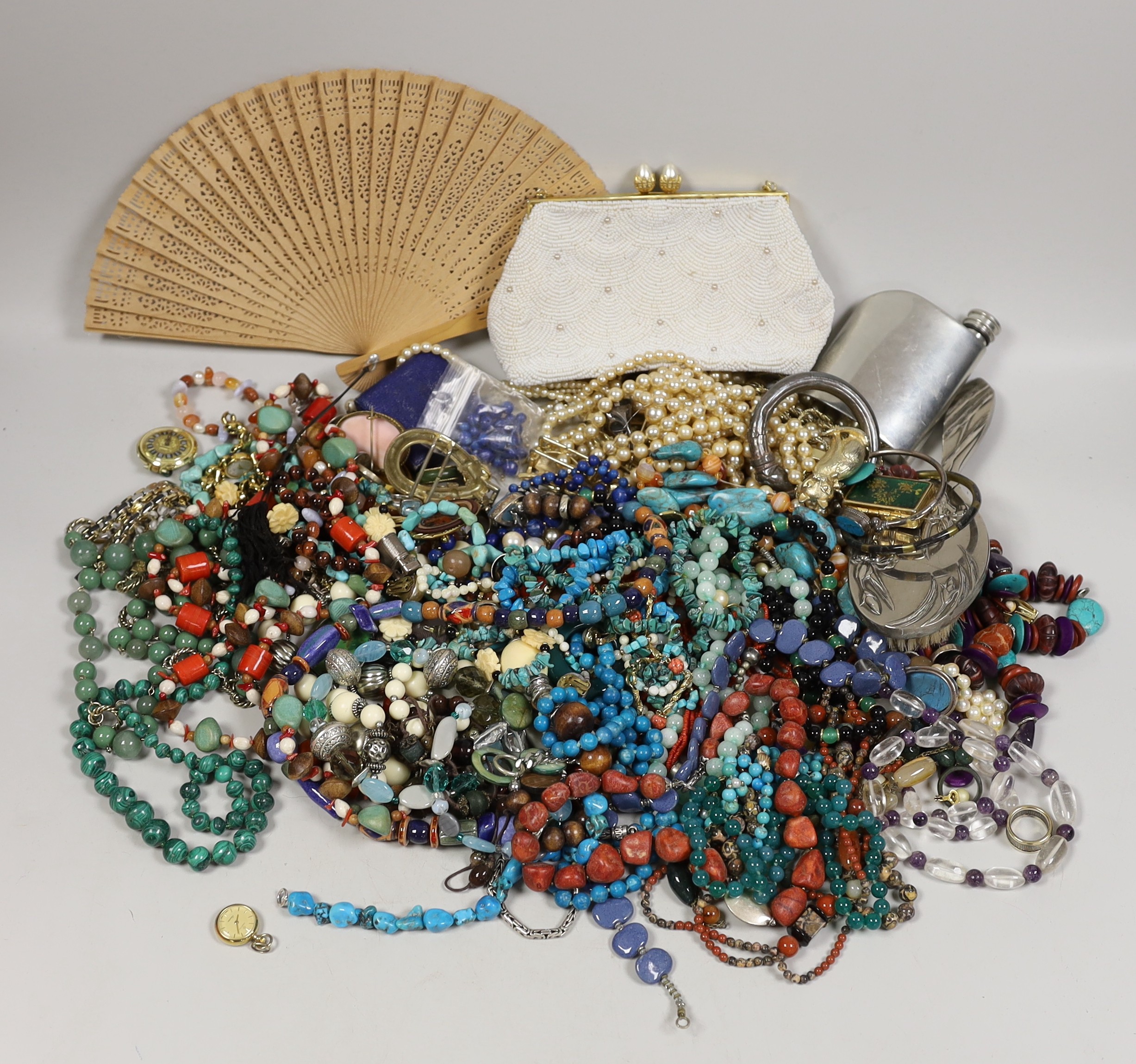 A quantity of assorted costume jewellery, including white metal and moonstone bracelet and other items including a small silver plated Dunhill lighter.